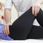 doctor treating hip issue