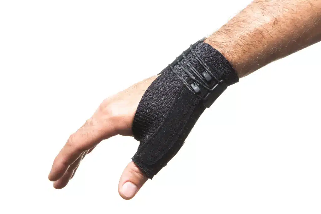 A person wearing a thumb brace for thumb pain.